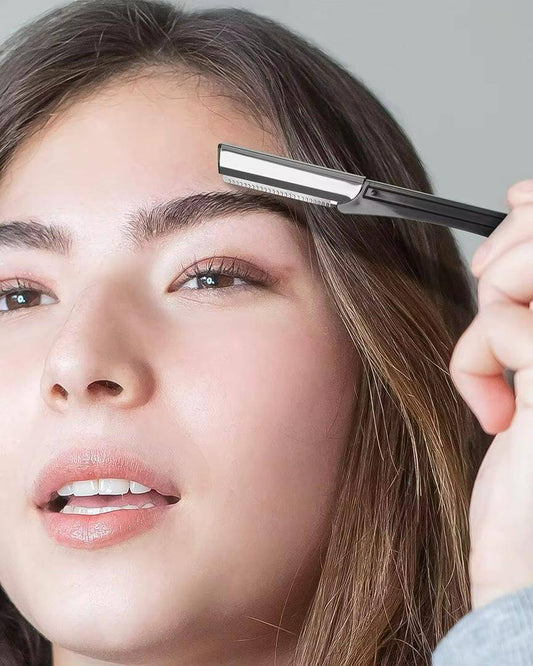 Model using an eyebrow and facial hair trimmer for precise grooming and shaping of eyebrows.